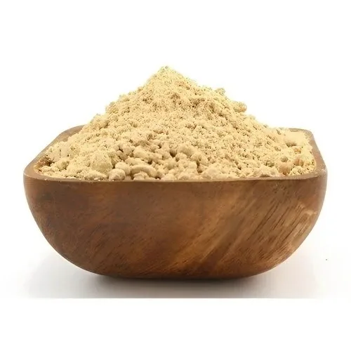 Groundnut shell powder in a wooden bowl